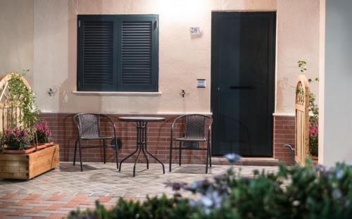 a patio with chairs and a table in front of a building at Il Rifugio di San Francesco in Bastia Umbra