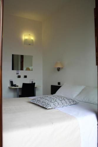 Katil atau katil-katil dalam bilik di Hotel La Locanda