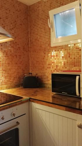 Kuchyň nebo kuchyňský kout v ubytování Estudio Jazmín