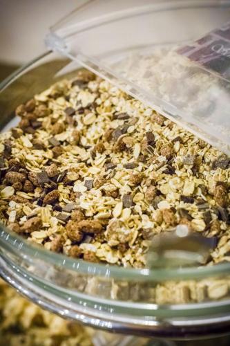 a glass display case with a pile of granola at Burghotel Haselünne in Haselünne