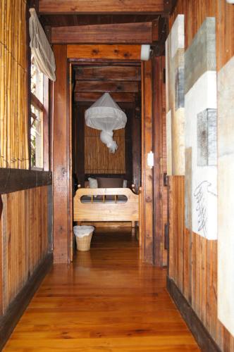 a hallway with a bed in a room at House 23 Ezulwini in Sodwana Bay Lodge in Sodwana Bay