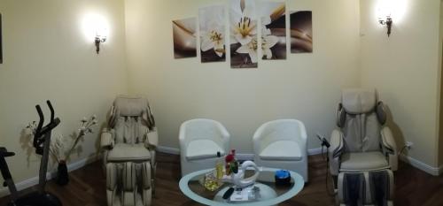 a waiting room with two chairs and a table at Freedom Love B&B in Rome