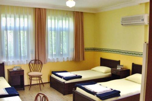 Postel nebo postele na pokoji v ubytování Emin Apart Hotel