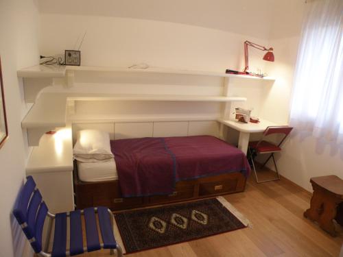 Un ou plusieurs lits dans un hébergement de l'établissement B&B Villa KK Rooms Padova