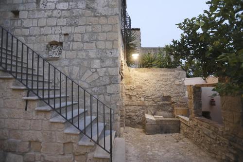 a stairway leading up to a stone building with a staircase at Casa Aulivo in Caiazzo