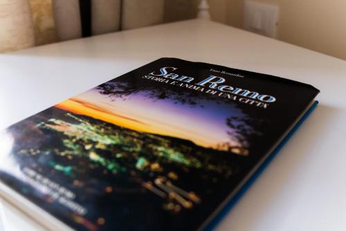 a book sitting on top of a table at Emily Rooms in Sanremo