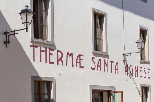 a building with a sign on the side of it at Hotel Delle Terme Santa Agnese in Bagno di Romagna
