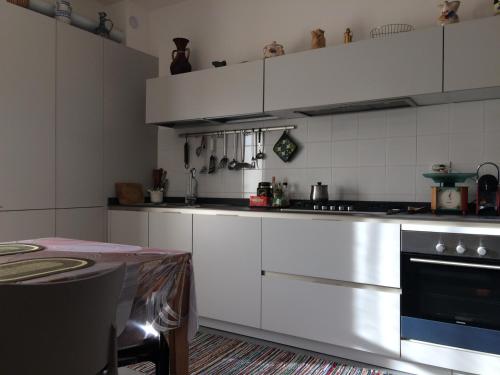 Kuchyň nebo kuchyňský kout v ubytování B&B Pergolesi