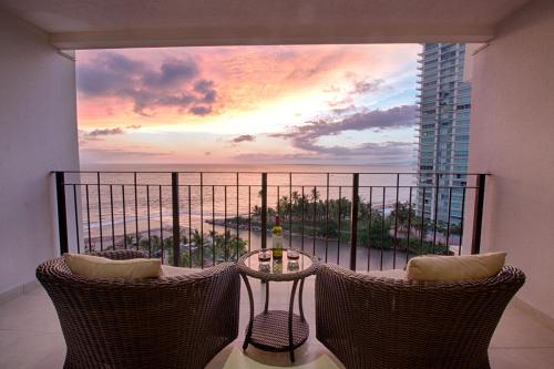 a balcony with a view of the ocean from a condo at 910-3000 Grand Venetian P.V. in Puerto Vallarta
