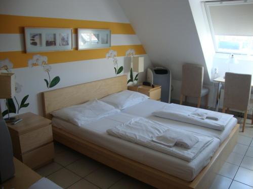 Krevet ili kreveti u jedinici u okviru objekta Lenas Donau Hotel