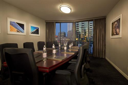 a conference room with a long table and chairs at Warwick Seattle in Seattle