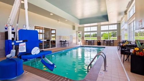 a swimming pool with a slide in a building at Best Western Plus Patterson Park Inn in Arkansas City