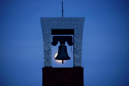 a bell in a room with a blue light at Pension Ashitaya in Furano