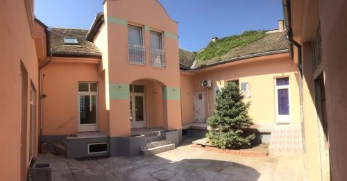 a house with a christmas tree in the courtyard at Apartment Mašić in Sombor