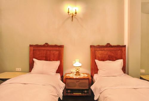 Ένα ή περισσότερα κρεβάτια σε δωμάτιο στο Hotel Evmolpia