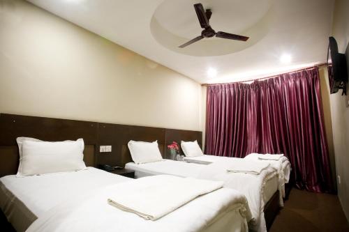 Voodi või voodid majutusasutuse Hotel Nandini toas