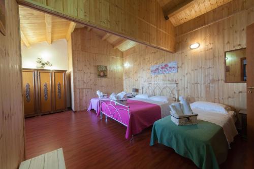 En eller flere senger på et rom på Acqua di Mare