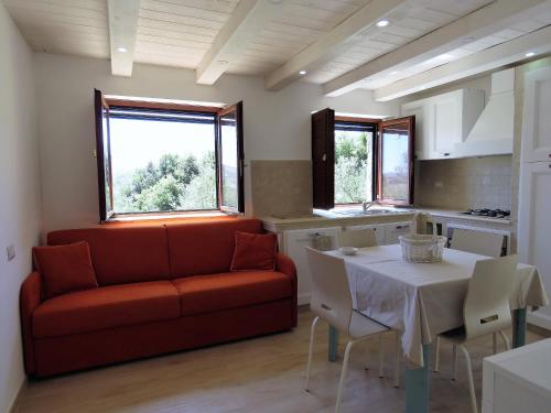 a living room with a couch and a table at Villa Greco in Rossano