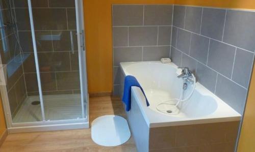 a bathroom with a sink and a shower and a toilet at Aubépine in Sains-du-Nord