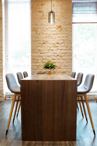 a table in a room with chairs around it at Artyzen Habitat Dongzhimen Beijing in Beijing