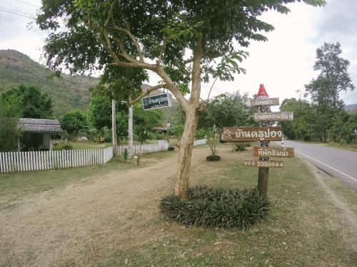 a street sign on the side of a road at Baan Krupong in Ban Tha Thong Mon
