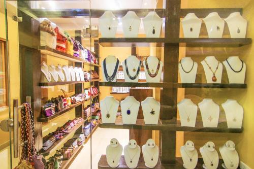 a display case in a store with shirts and ties at Kuti Resort & Spa in Pokhara