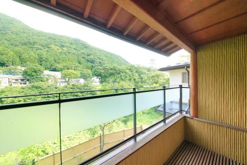 a balcony with a view of a mountain at Micasa in Minakami