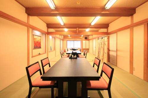a conference room with a long table and chairs at Micasa in Minakami