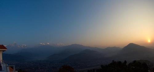 a view of a mountain range at sunset at Himalayan Front Hotel by KGH Group in Pokhara