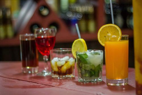 a group of different types of drinks on a table at Dovenest Lodge in Naivasha
