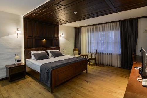 Säng eller sängar i ett rum på Hotel Tiffany
