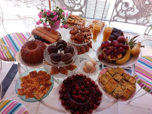 a table topped with lots of different types of food at Veranda Syros House in Ermoupoli