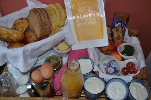 a tray of food with bread eggs and other foods at B&B MACBED CHECKIN-TIME 1700-1800 or request before you book in Alkmaar