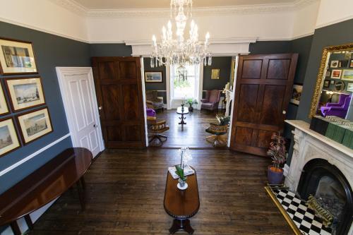 a living room filled with furniture and a fireplace at Charleville Lodge Hotel in Dublin