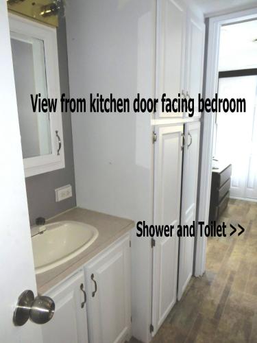 a bathroom with a sink and a mirror at Boardwalk RV Rental (Site #13) in Cavendish
