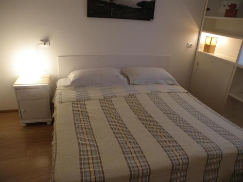 Un ou plusieurs lits dans un hébergement de l'établissement B&B Villa KK Rooms Padova