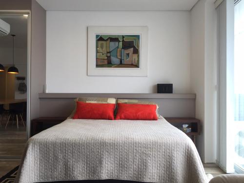 Katil atau katil-katil dalam bilik di Loft com vista para o mar