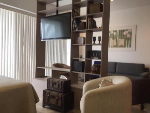 Posezení v ubytování Loft com vista para o mar