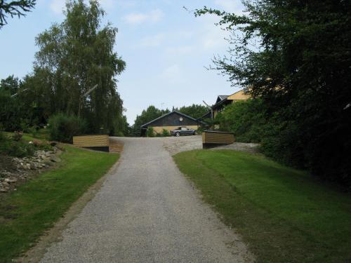 a gravel road with a house in the background at Motel Europa in Svenstrup