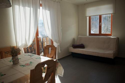 Postel nebo postele na pokoji v ubytování Guesthouse Planinski Dom Majerhold