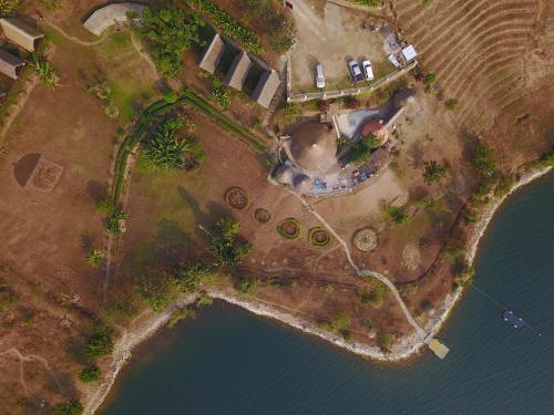 an aerial view of an island next to a body of water at Rwiza Village in Gitesi
