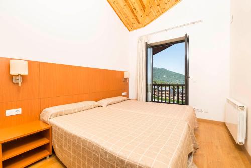
Cama o camas de una habitación en Guitart La Molina Aparthotel & Spa
