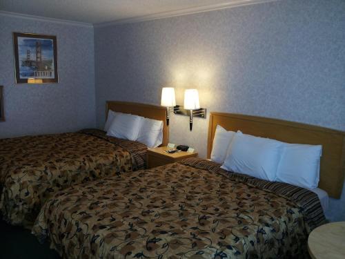 Postel nebo postele na pokoji v ubytování Castle Inn