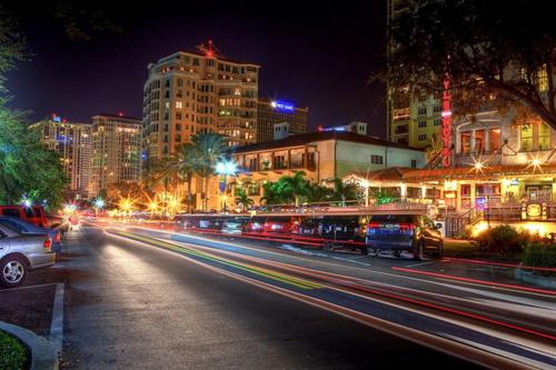 a city street at night with cars and buildings at Hyatt Place St. Petersburg/Downtown in St Petersburg
