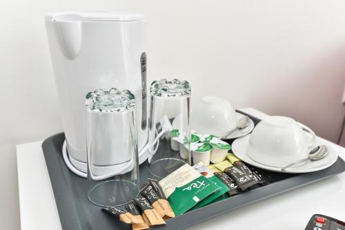 a tray with dishes and a blender on a table at Riverbank Stay in London