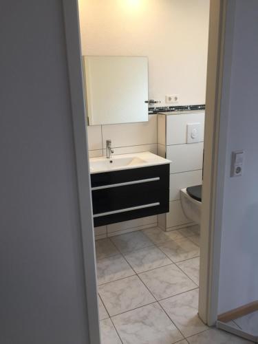 Ванная комната в A & J Ferienwohnung Hirsch