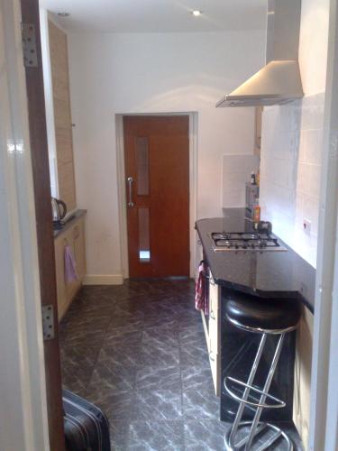 a kitchen with a stove and a counter top at OutRam 26 in Stockton-on-Tees