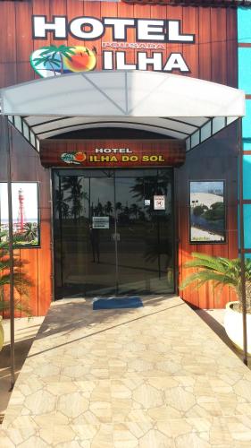 an entrance to a hotel with an open door at Pousada Ilha do Sol in Salinópolis