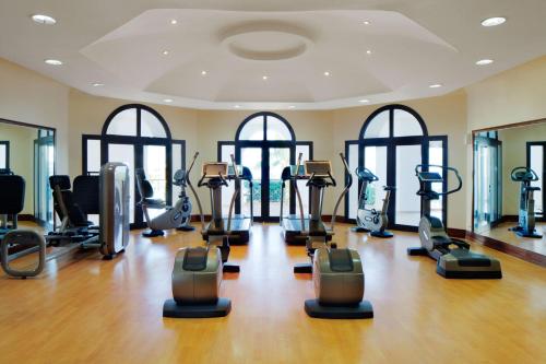 a gym with treadmills and elliptical machines at Park Regency Sharm El Sheikh Resort in Sharm El Sheikh