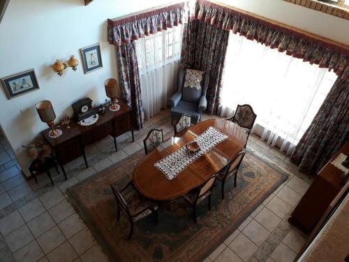 an overhead view of a dining room with a table and chairs at Arbuckle House in Himeville